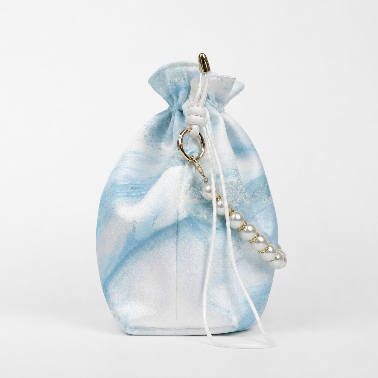 Drawstring pearl bag  Marbled in Natural Lacquer · Never the Same Twice